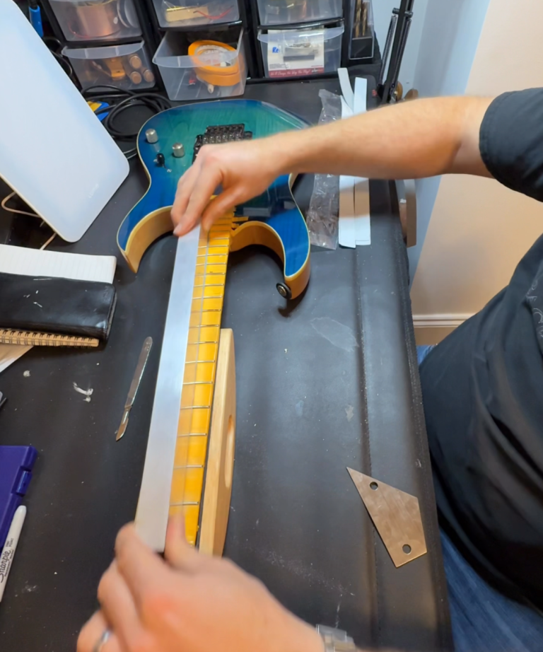 Expert guitar fretwork and fret levelling Precision fret levelling and fretwork carried out on a guitar neck by a professional guitar technician